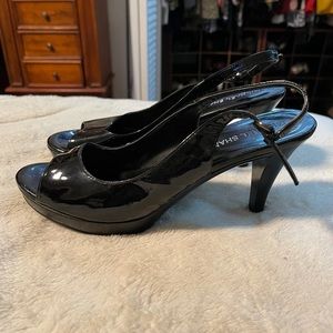 Patent leather, black pumps by Michael Shannon